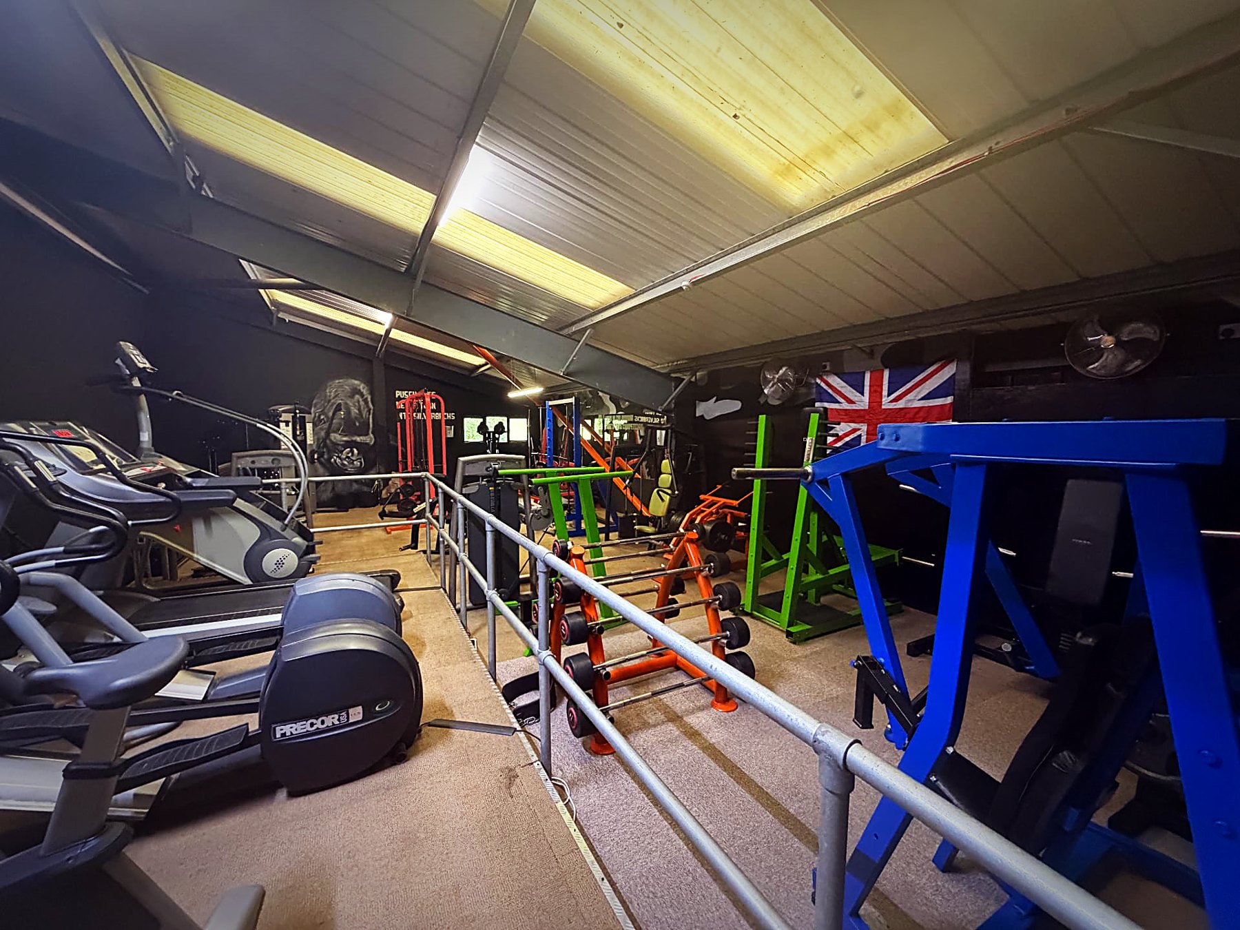 Upstairs cardio and machine deck under the Union Jack