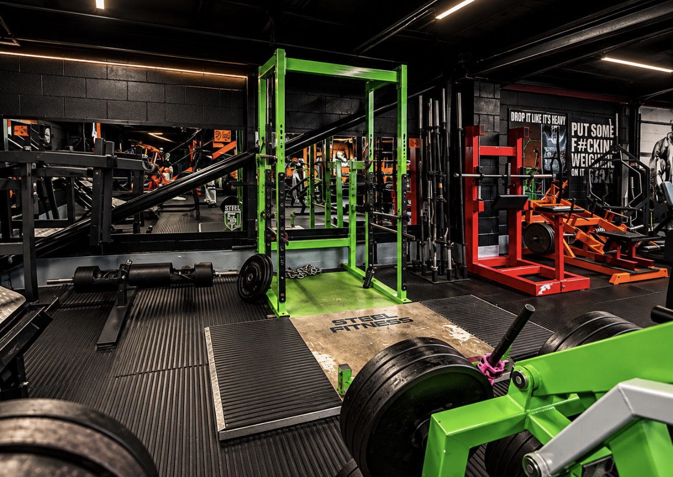 Green power rack, lifting platform and plates at Steel Gym Thetford
