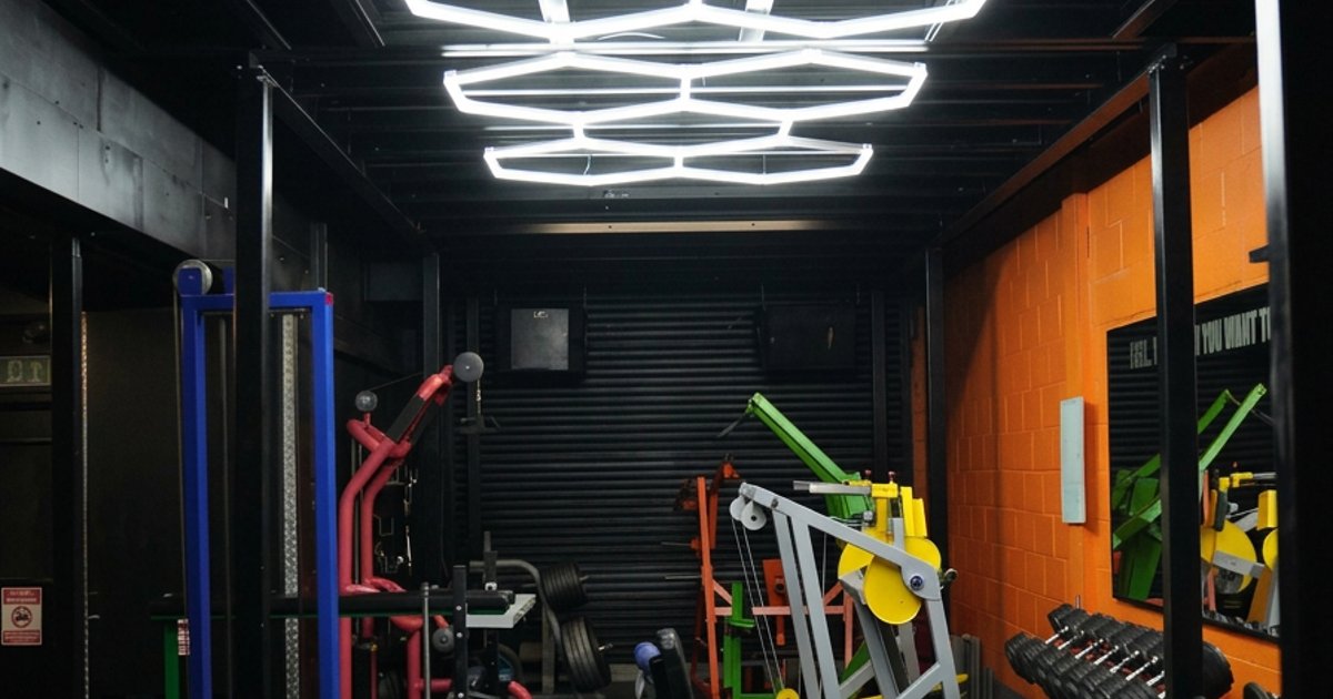Strength equipment and orange walls at Steel Gym Thetford